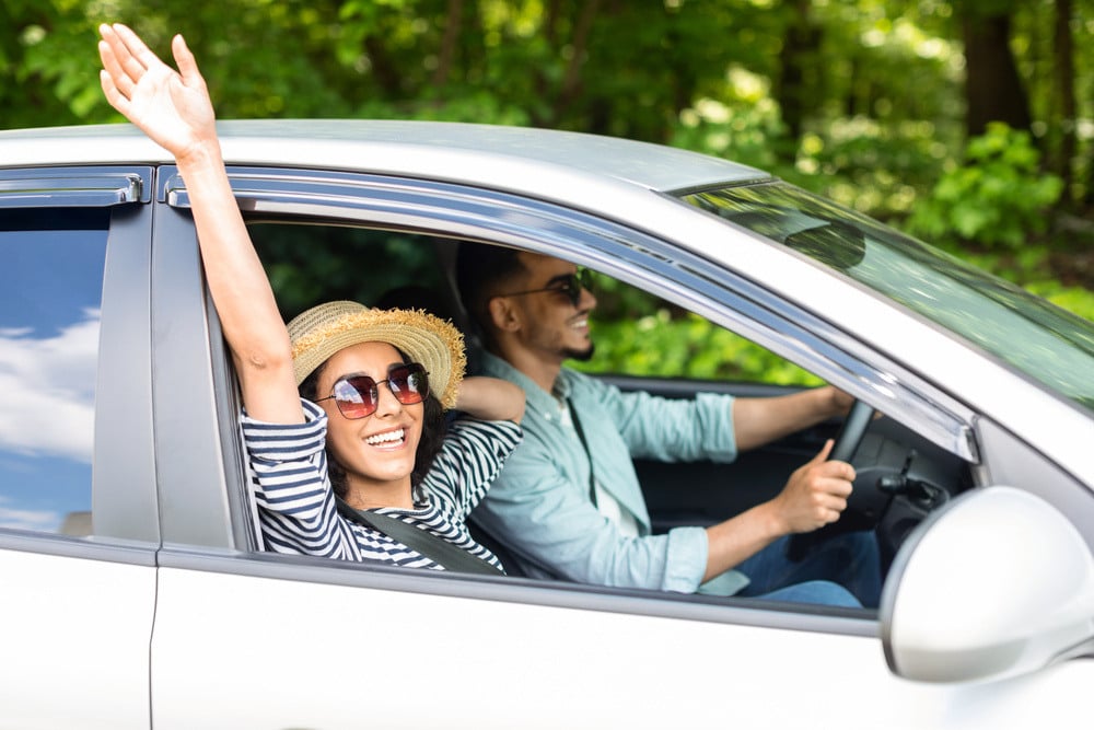 ecstatic-millennial-husband-and-wife-having-car-tr-2023-11-27-05-12-07-utc (1)-1