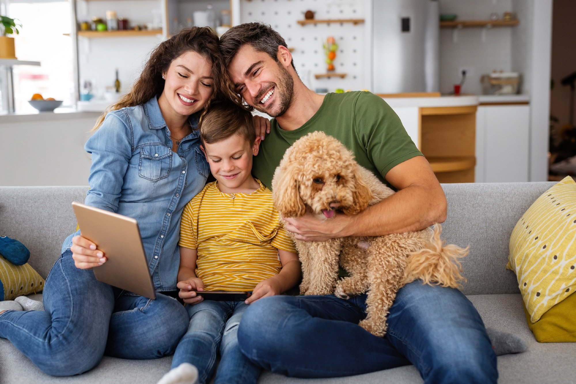 happy-family-with-modern-devices-and-dog-having-fu-2021-09-02-07-57-47-utc-2